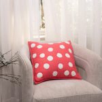Amity home dottie pillow in hot pink with white textured polka dots