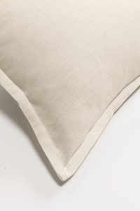 Amity home duvet cover   close up of ivory linen blend fabric with a subtle woven texture and tailored flange edge
