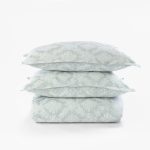 Amity home dawson french ikat duvet cover and shams in sea glass featuring a soft abstract geometric pattern neatly stacked