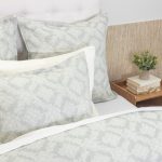 Amity home dawson french ikat duvet cover and shams in sea glass and white with a soft geometric pattern on a styled bed