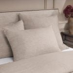Amity home damara duvet cover   natural beige linen look bedding on a styled bed with matching pillow shams