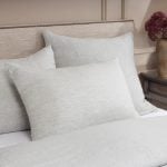 Amity home damara duvet cover   soft sea glass linen bedding and matching pillows on a luxury styled bed