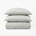 Amity home damara duvet cover and shams   sea glass colored linen bedding with a soft textured weave stacked on a white background