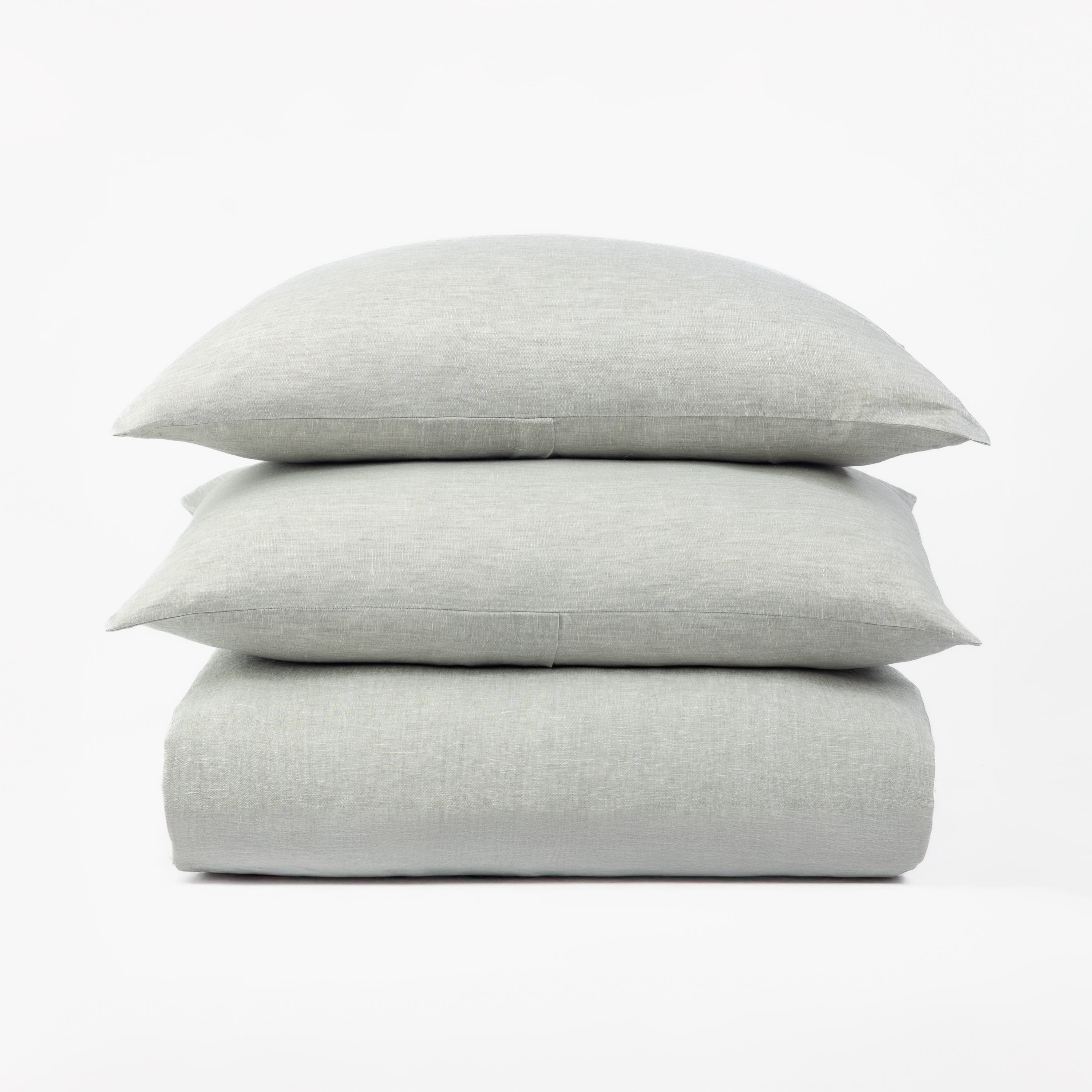 15355sgmal65 | Amity Home Amity home damara duvet cover and shams sea glass colored linen bedding with a soft textured weave stacked on a white background