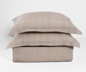Amity home zach linen duvet cover and shams in natural beige with a subtle plaid pattern stacked on a white background