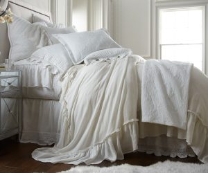 Amity home caprice duvet cover   ivory ruffled duvet cover draped on a luxurious bed with layered pillows and a crochet throw