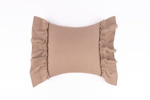 Amity home lumbar pillow in walnut brown with soft ruffled edges on a textured linen look fabric