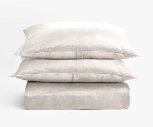 Amity home lia rayon velvet duvet cover in oyster stacked with two matching pillows showing soft luxurious texture