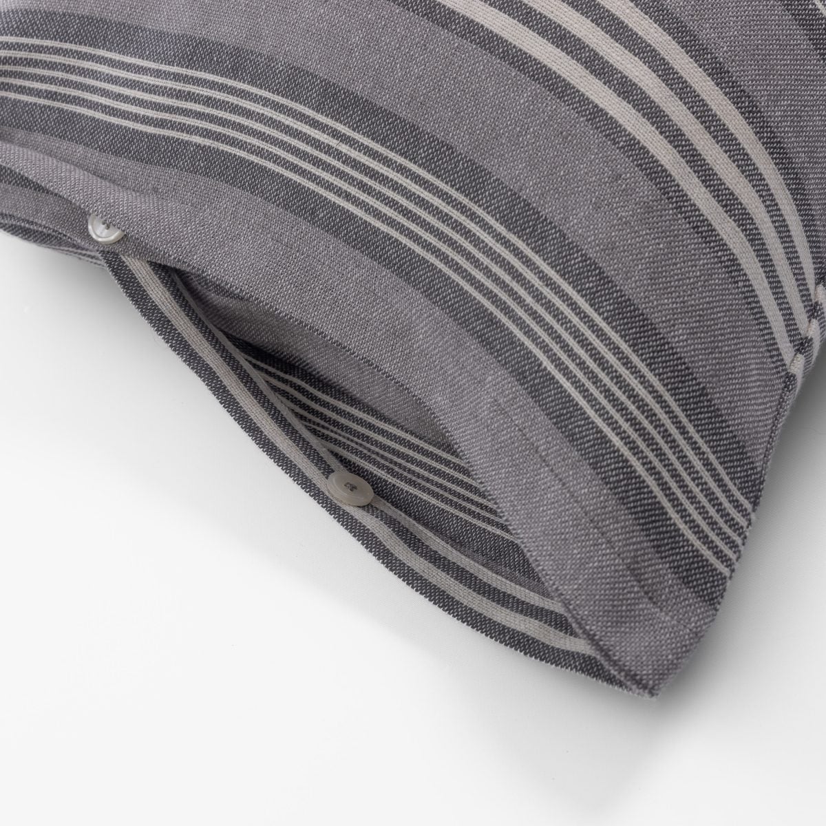Amity home langston linen duvet cover   close up of grey and light beige striped linen fabric with button closure detail