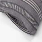 Amity home langston linen duvet cover   close up of grey and light beige striped linen fabric with button closure detail