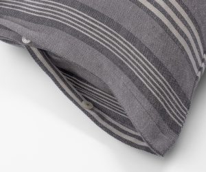 Amity home langston linen duvet cover   close up of grey and light beige striped linen fabric with button closure detail