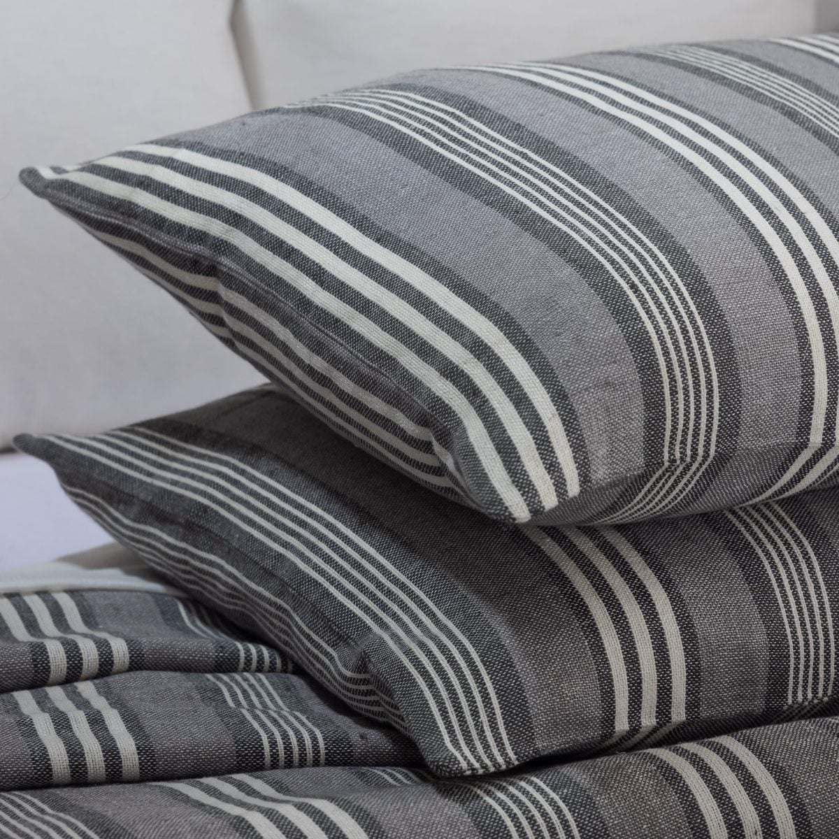 Amity home langston linen duvet cover   close up of grey linen bedding with white stripes showing woven texture