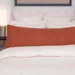 Amity home ranier linen body pillow in burnt sienna   frayed edge detail