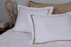 Amity home savona duvet cover in white with caramel trim   ladder stitch detail