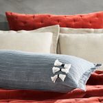 Amity home cambria bolster in steel blue   textured with tassels