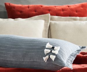Amity home cambria bolster in steel blue   textured with tassels