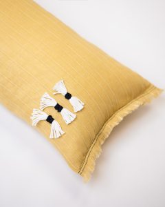 Amity home cambria bolster in ochre   decorative tassels