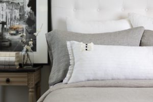 Amity home cambria bolster in white   decorative tassels