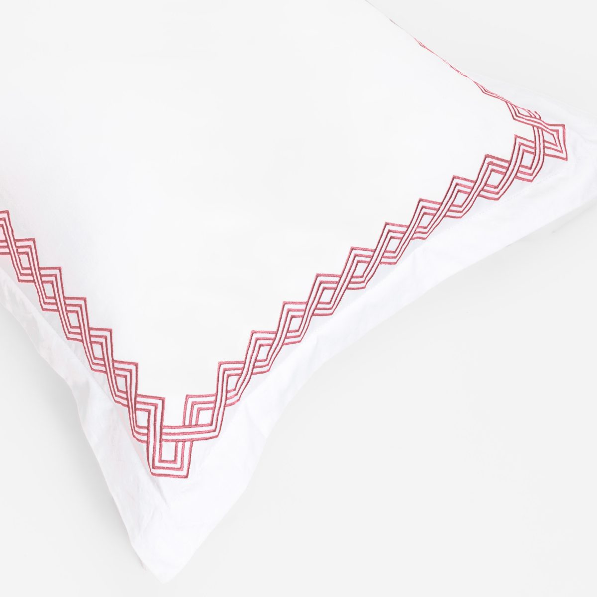 Amity home amalfi duvet cover in white with coral   interlocking border embroidery