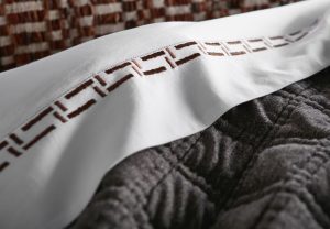 Amity home baker  fletcher collection in white with brown embroidery   geometric border