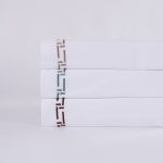 Amity home ellis sheet set in white with saddle  teal embroidery   geometric border
