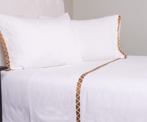 Amity home turin sheet set in white with ochre   embroidered triangle trim