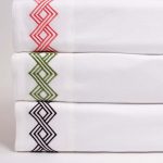 Amity home amalfi sheet set in white with coral embroidery   geometric pattern