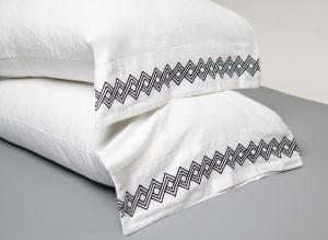 Amity home amalfi pillowcases in white with asphalt   geometric embroidery