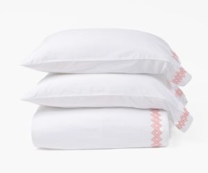 Amity home amalfi sheet set in whitecoral   embroidered geometric pattern