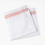 Amity home amalfi sheet set in white with coral   embroidered coral design