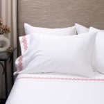 Amity home amalfi sheet set in white with coral   geometric embroidery