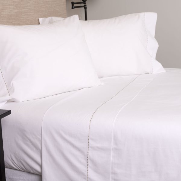 Amity home talo sheet set in white with caramel stitching   dotted stitch detail