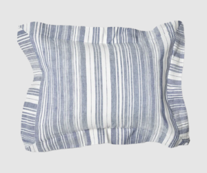 Striped blue and white pillow on a light gray background informative