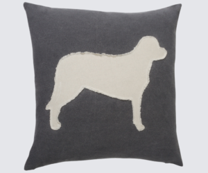 Dark gray square throw pillow with a cream colored dog silhouette appliqué in the center