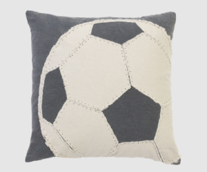 Decorative square pillow with a large cream and navy soccer ball patchwork pattern