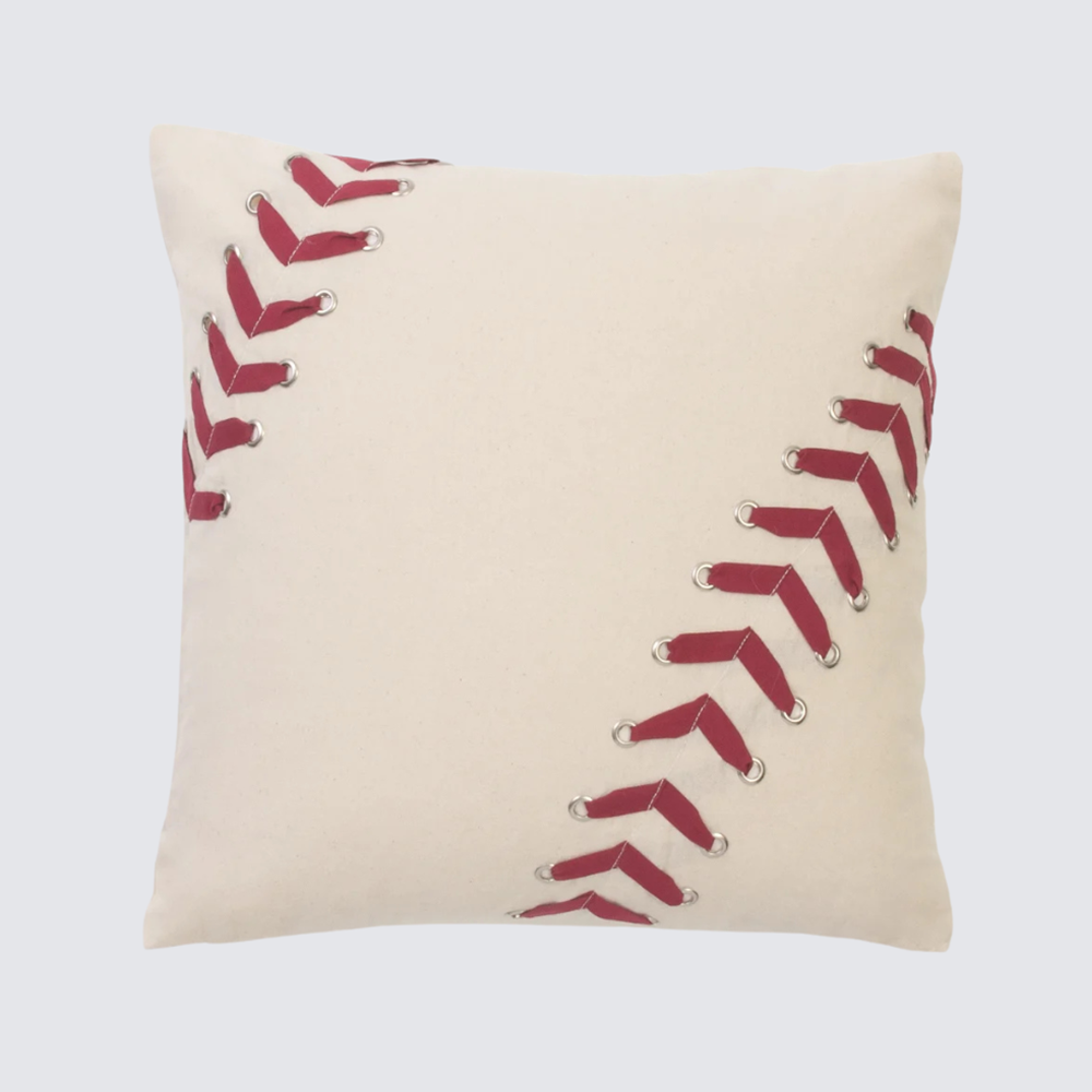 Cc90820 | Amity Home Beige decorative pillow with red baseballstitch style lacing along diagonal seams on cream fabric