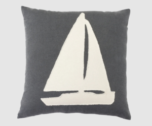 Grey decorative pillow with a white sailboat graphic