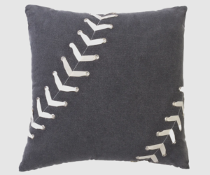 Decorative navy pillow with white curved stitch embellishments along diagonal seams on dark fabric