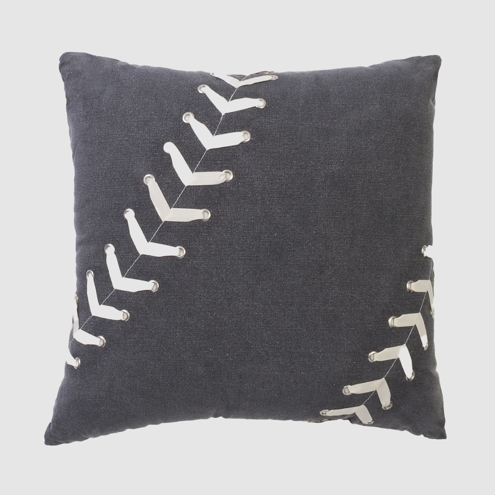Cc91924 | Amity Home Decorative navy pillow with white curved stitch embellishments along diagonal seams on dark fabric