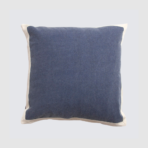 Blue square decorative pillow with off white piping along edges