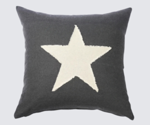 Dark gray throw pillow with a large white star in the center