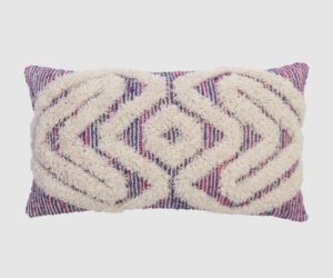 Rectangular decorative pillow with a cream raised geometric pattern on a purple striped fabric