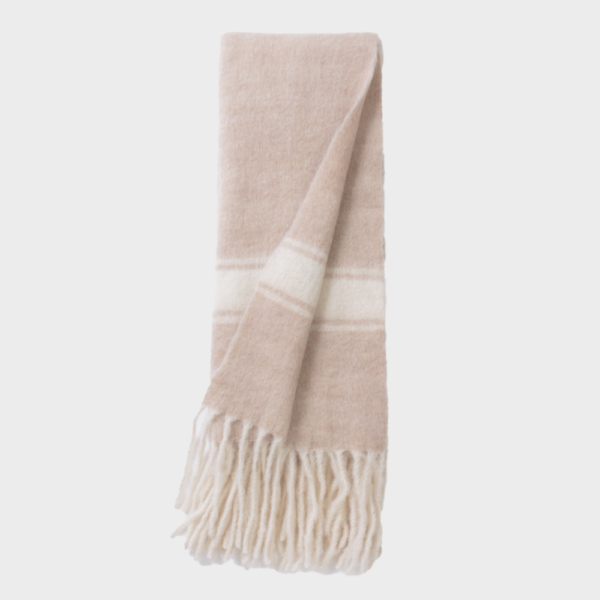 Soft blush pink scarf with cream stripes and fringe at the ends, folded vertically.