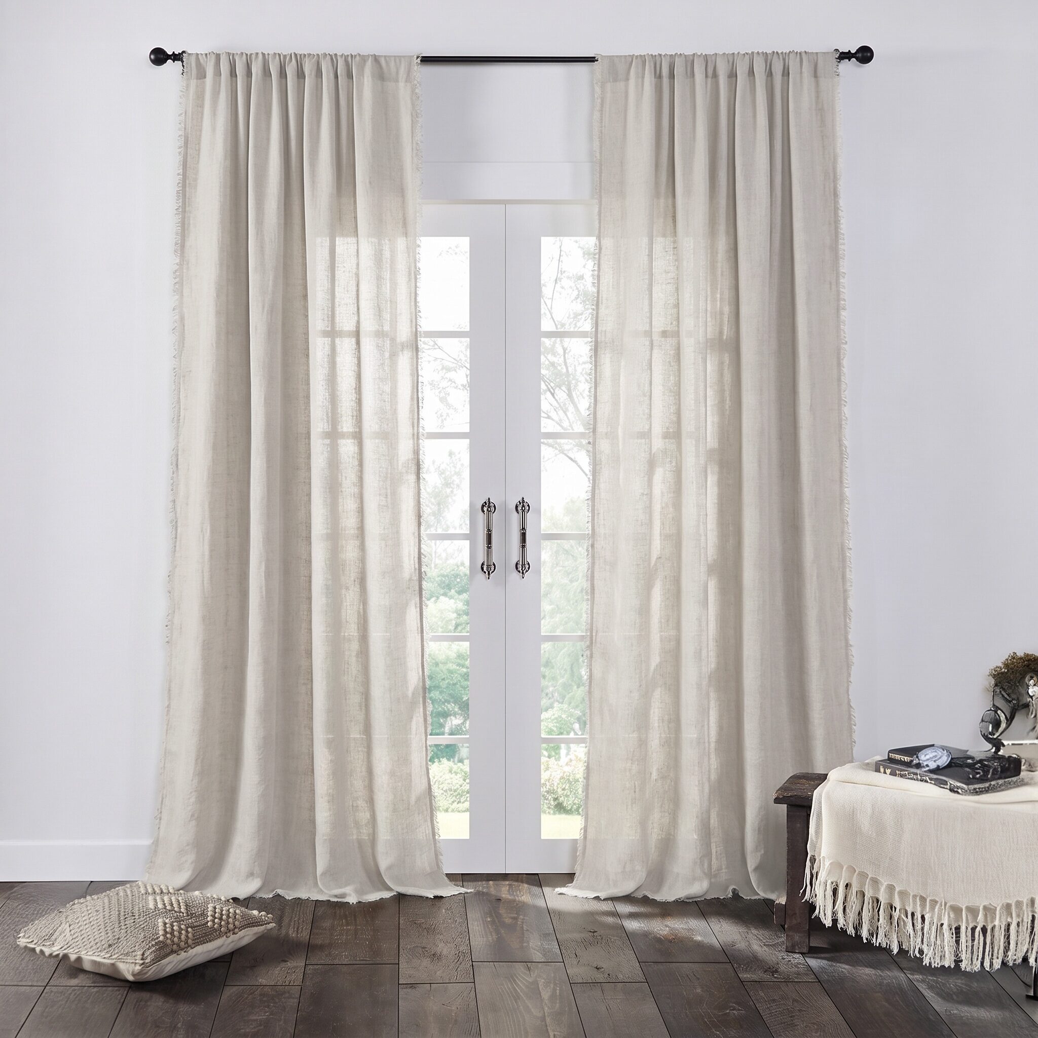 Kentlinenreversiblecurta117171 12 | Amity Home Beige sheer curtains on glass french doors a cozy living room with a dark wood floor nearby and soft textiles nearby