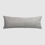 Long gray rectangular throw pillow with textured fabric on a light background|