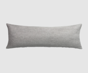 Long gray rectangular throw pillow with textured fabric on a light background|