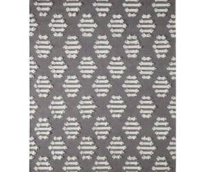 Gray rug with a repeating white tufted oval pattern on a dark background decorative area rug