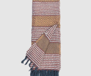 Woven scarf with geometric brown and tan patterns white stripes and blue fringe at ends