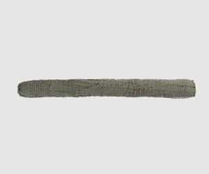 Long patched fabric strip with visible embroidery stitches and frayed edges laid on a light background