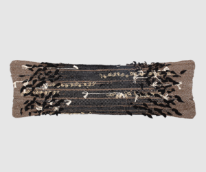 Decorative rectangular sequin pillow with black and beige reversible sequins laid flat on a light gray background